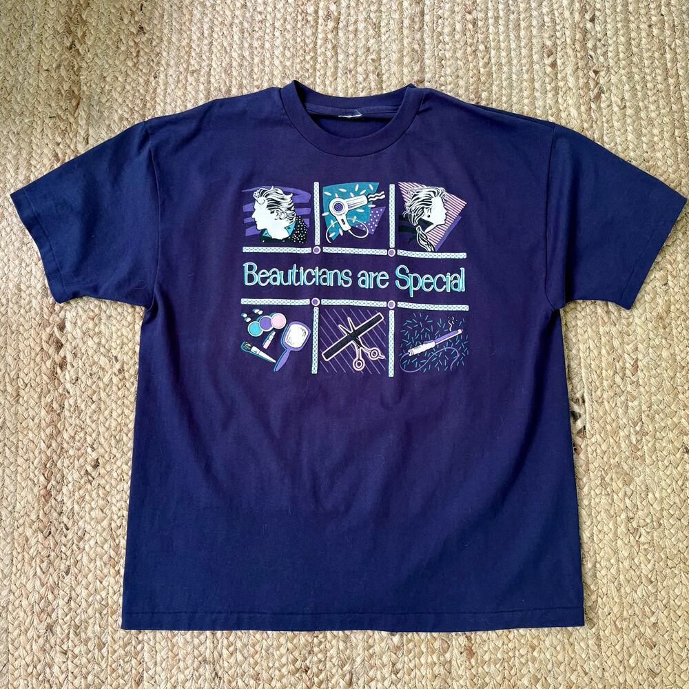 Vintage 90s navy blue T-shirt with beautician graphics